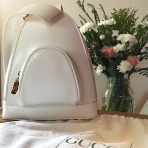 Gucci crossbody ‘backpack’ w/ wooden zip accents